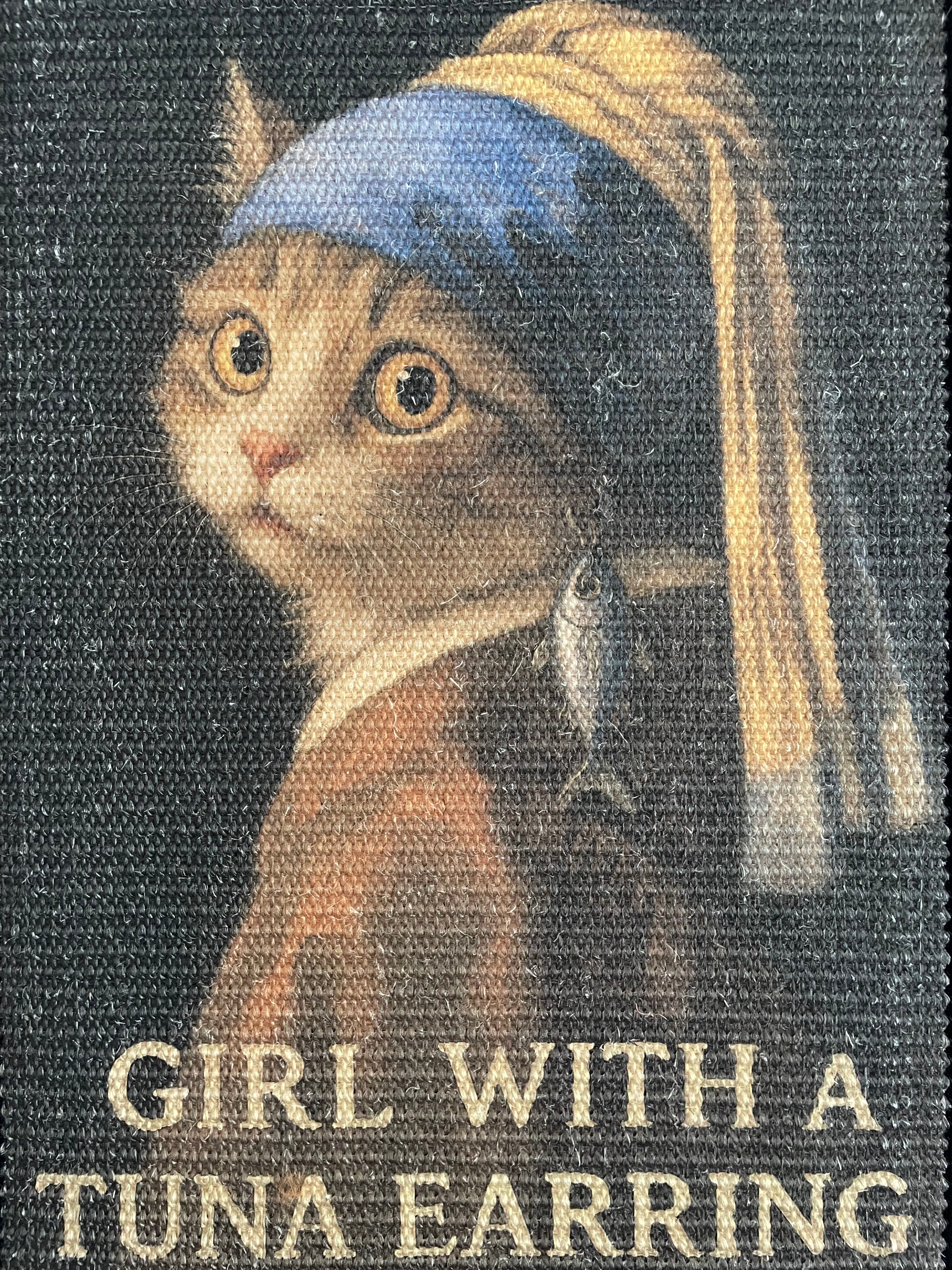 "Portrait of a Purr – The Tuna Earring Mat"