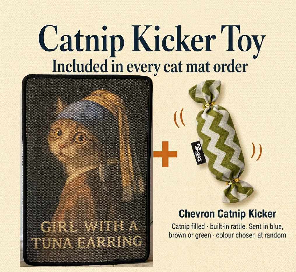Decorative wall art with a cat wearing a tuna earring, titled 'Girl with a Tuna Earring', on a plain wall.