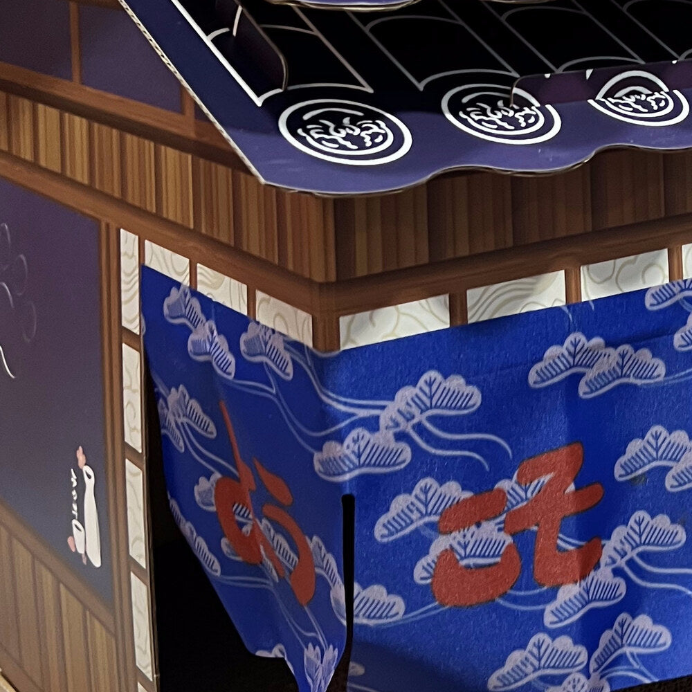 Indigo noren curtain with cloud pattern and a red 居 character
